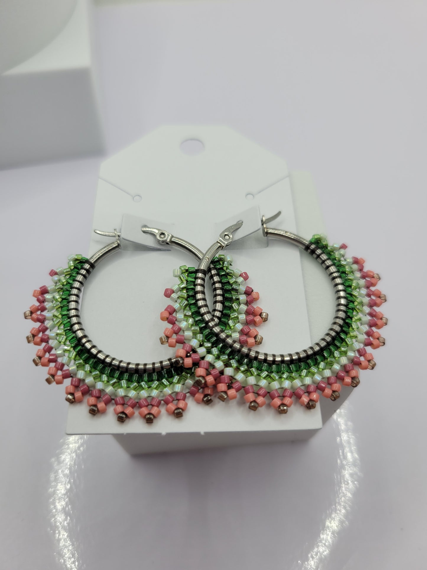 Multi-colored seed bead hoop earring